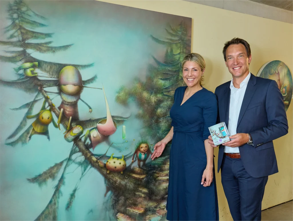 I Attended the World Premiere of the First-Ever PEZ Arts Edition! pez head of marketing u polymeropulos managing dir b rehrl with krichbaum s artwork